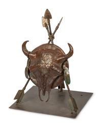 A Bronze Sculpture of a Buffalo Skull Mounted on a Shield and Arrows
