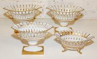 A Collection of Four Gilt Painted Porcelain Baskets Height of pair 8 1/4 x width 12 inches.