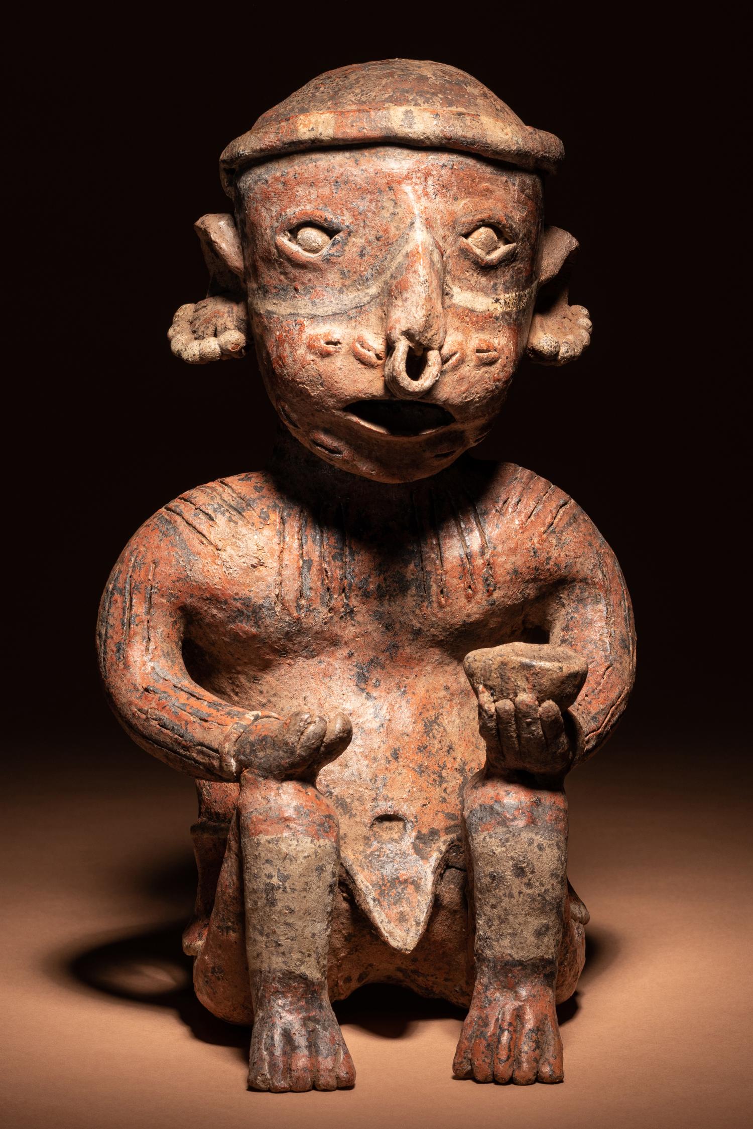 A Nayarit Seated Male Figure