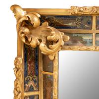 A Flemish Ebonized, Parcel Gilt and Reverse Painted Mirror