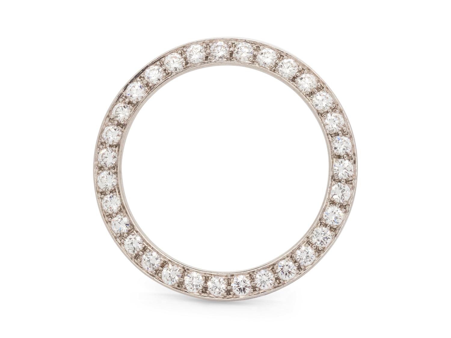 A Platinum and Diamond Circle Brooch,