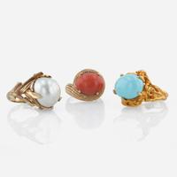 A collection of three 14K yellow gold and gem-set rings