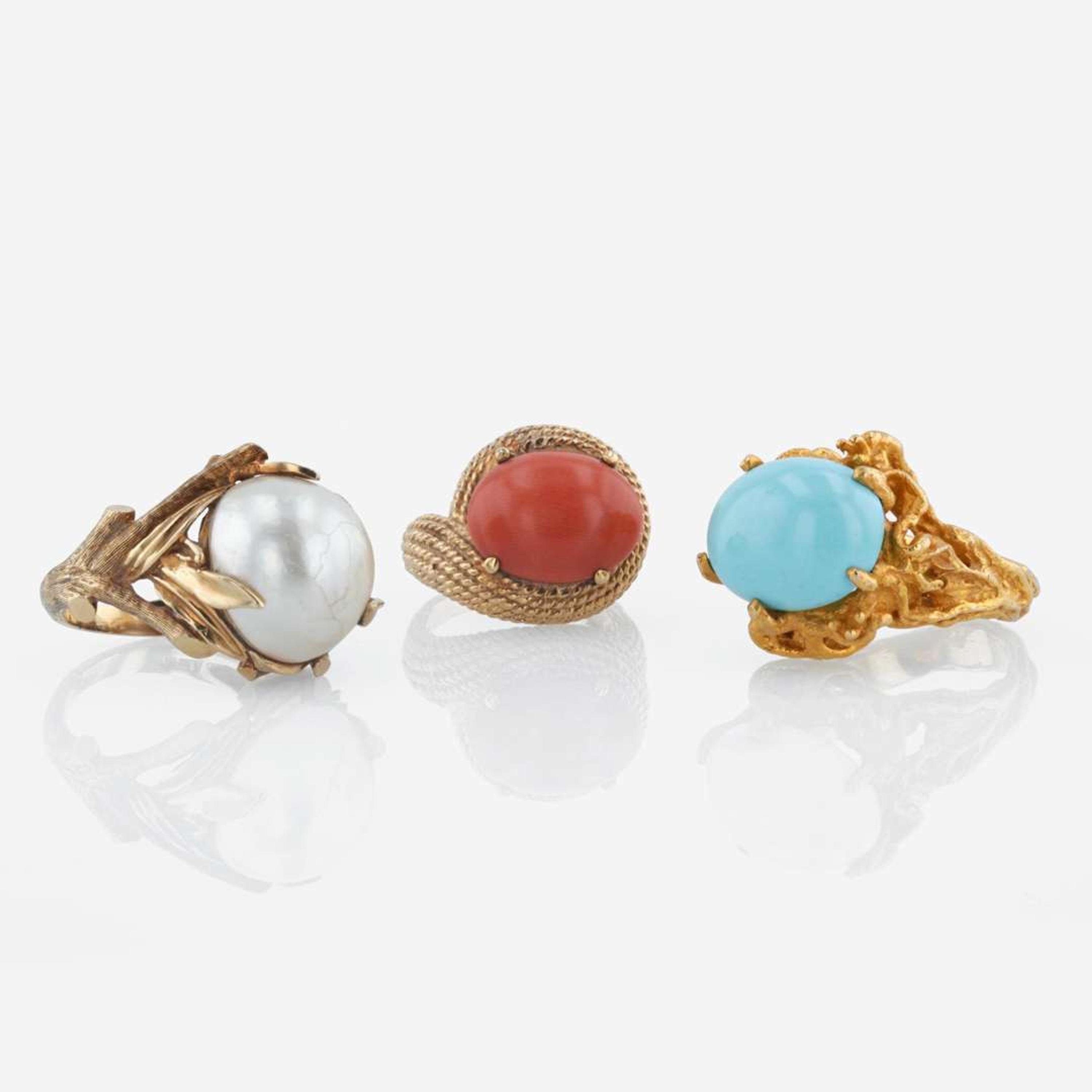 A collection of three 14K yellow gold and gem-set rings