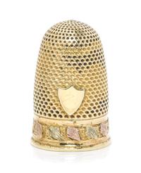 A Continental Tri-Color Gold Thimble, , the knurled domed top and body above a rose and white gold band of continuous foliate decoratio