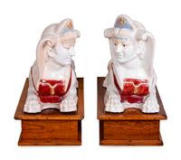 A Pair of Polychromed Ceramic Sphinxes — 20TH CENTURY