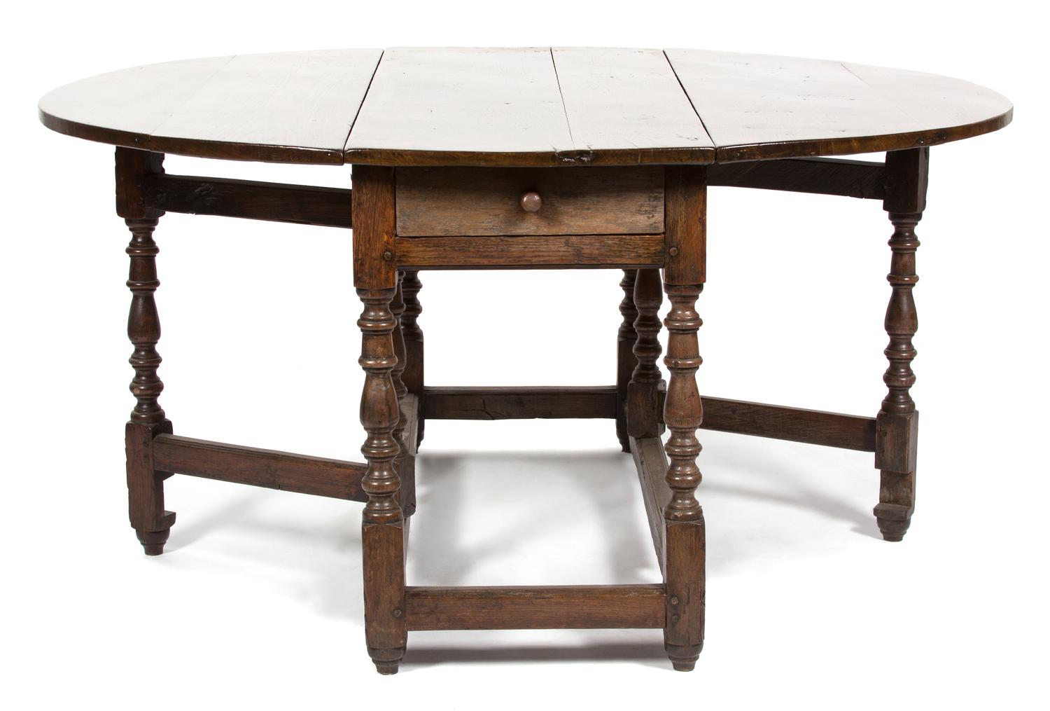 An English Oak Gate Leg Table Height 29 1/2 x width 52 x depth 21 inches (closed).