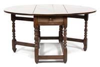 An English Oak Gate Leg Table Height 29 1/2 x width 52 x depth 21 inches (closed).