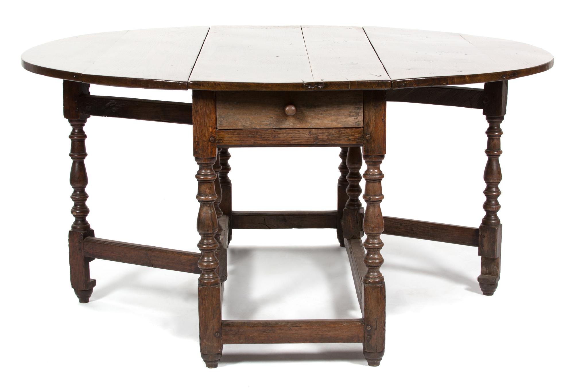An English Oak Gate Leg Table Height 29 1/2 x width 52 x depth 21 inches (closed).
