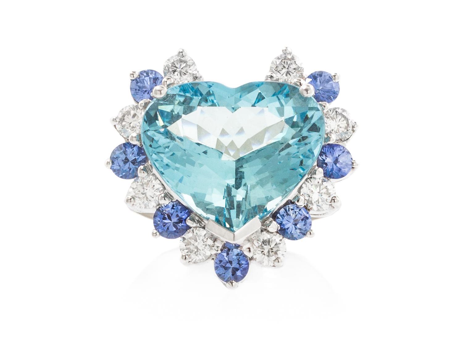 An 18 Karat White Gold, Aquamarine, Diamond and Sapphire Ring, 7.50 dwts.