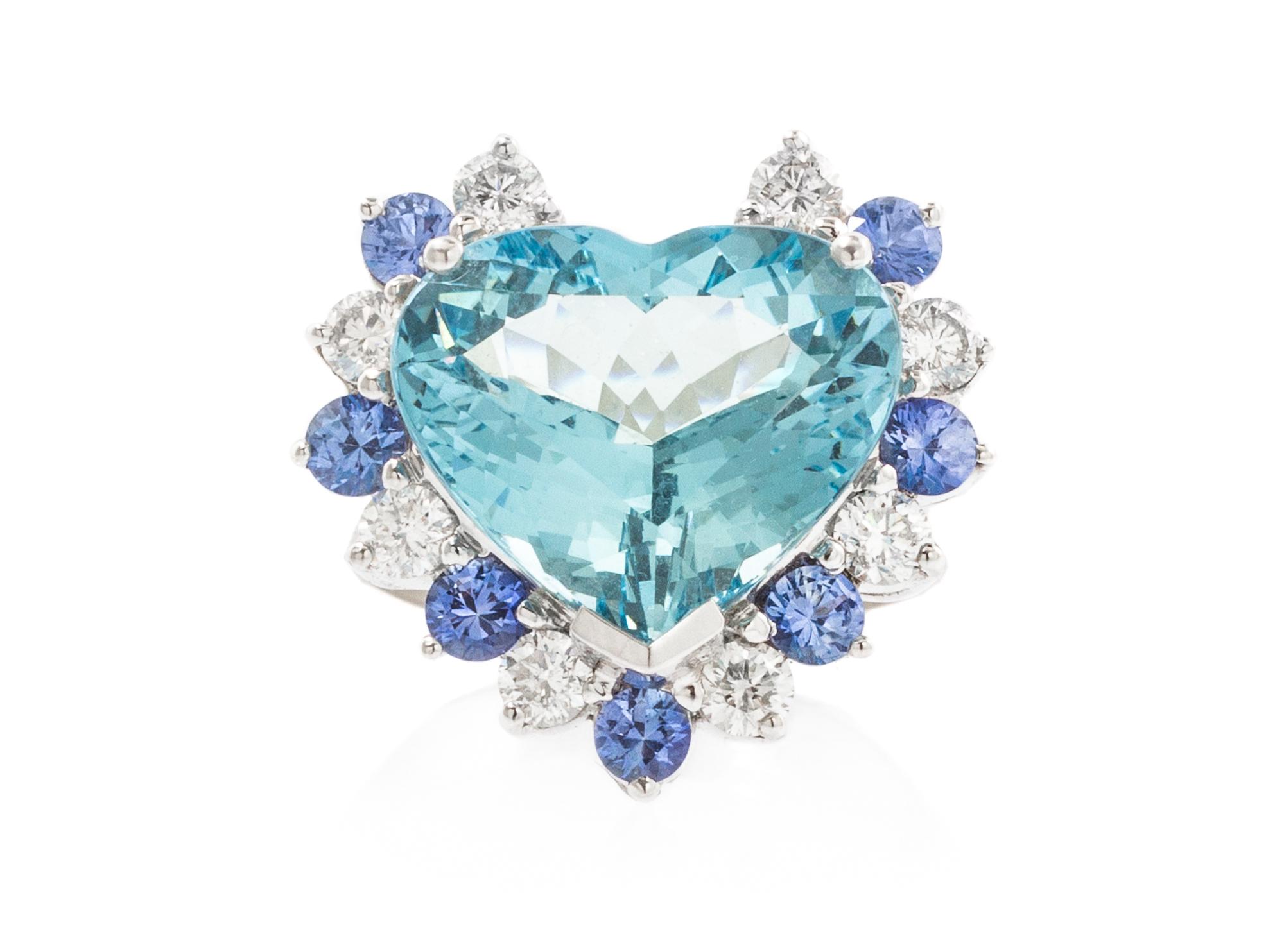 An 18 Karat White Gold, Aquamarine, Diamond and Sapphire Ring, 7.50 dwts.