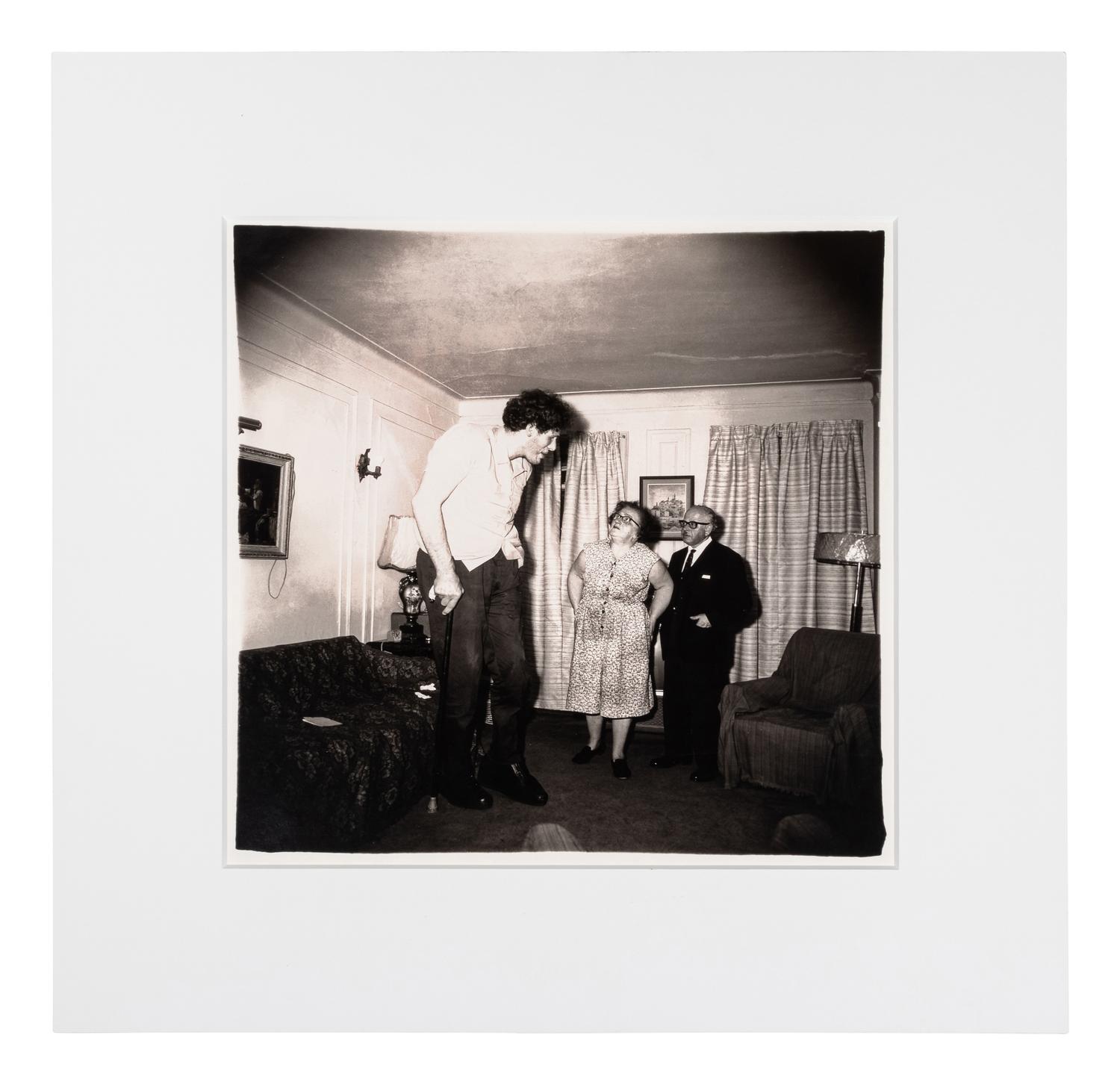 Diane Arbus (1923-1971) A Jewish giant at home with his parents in the Bronx, N.Y., 1970, from "A box of ten photographs," 1969-1973