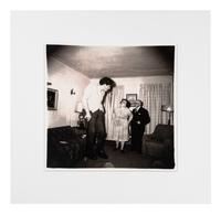 Diane Arbus (1923-1971) A Jewish giant at home with his parents in the Bronx, N.Y., 1970, from "A box of ten photographs," 1969-1973
