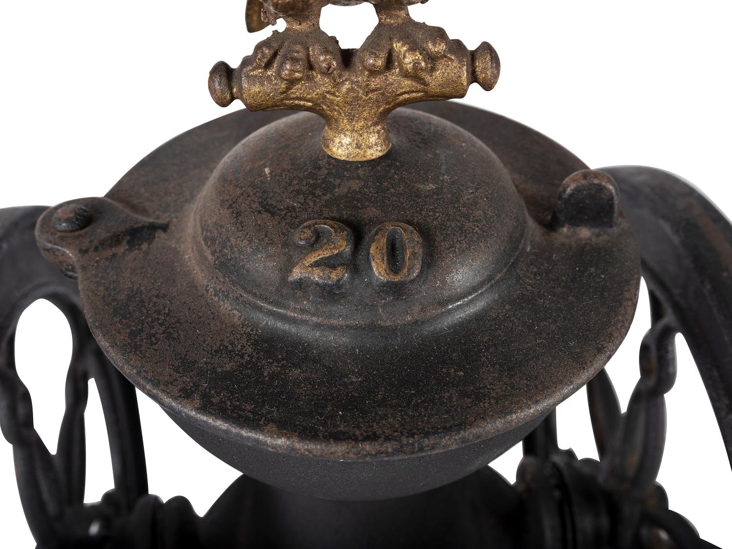 A Landers, Frary & Clark Cast Iron Coffee Mill with an Eagle Finial