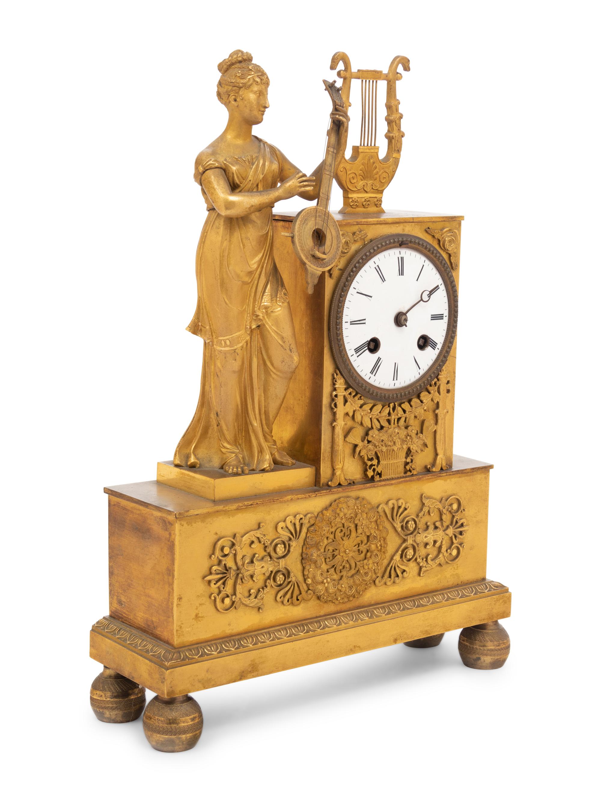 A French Gilt Bronze Figural Mantel Clock