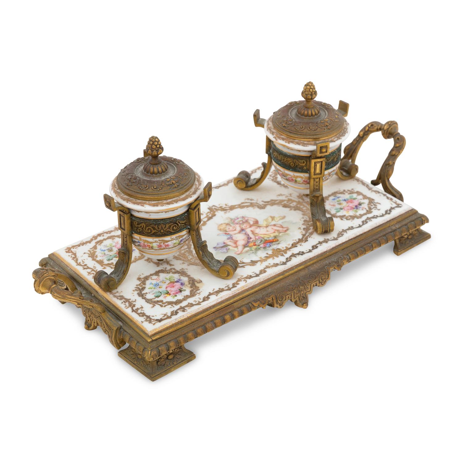 A Continental Enameled Porcelain and Gilt Metal Inkwell and Stand
