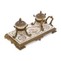 A Continental Enameled Porcelain and Gilt Metal Inkwell and Stand