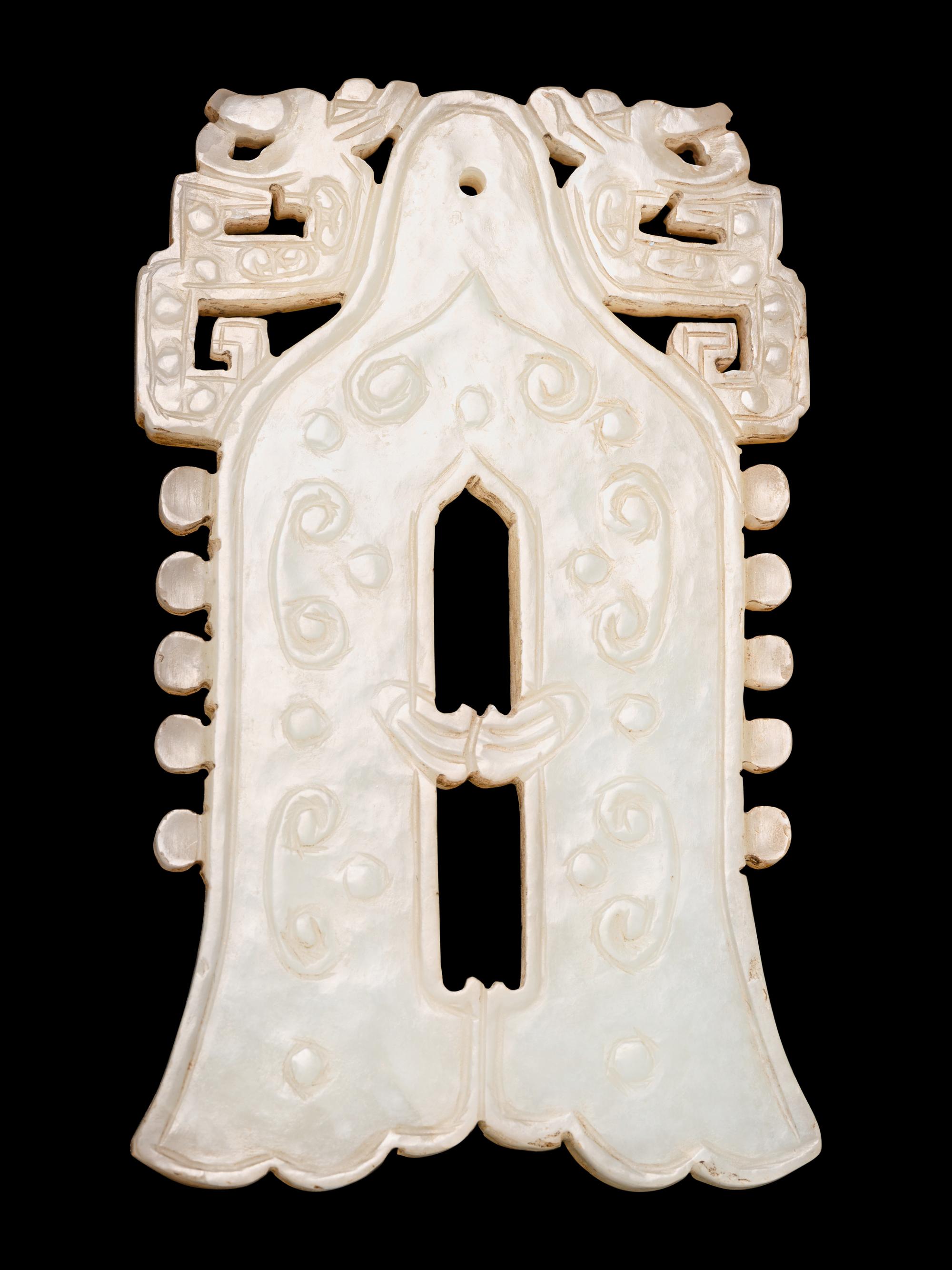 A Celadon Jade Bell-Form Pendant