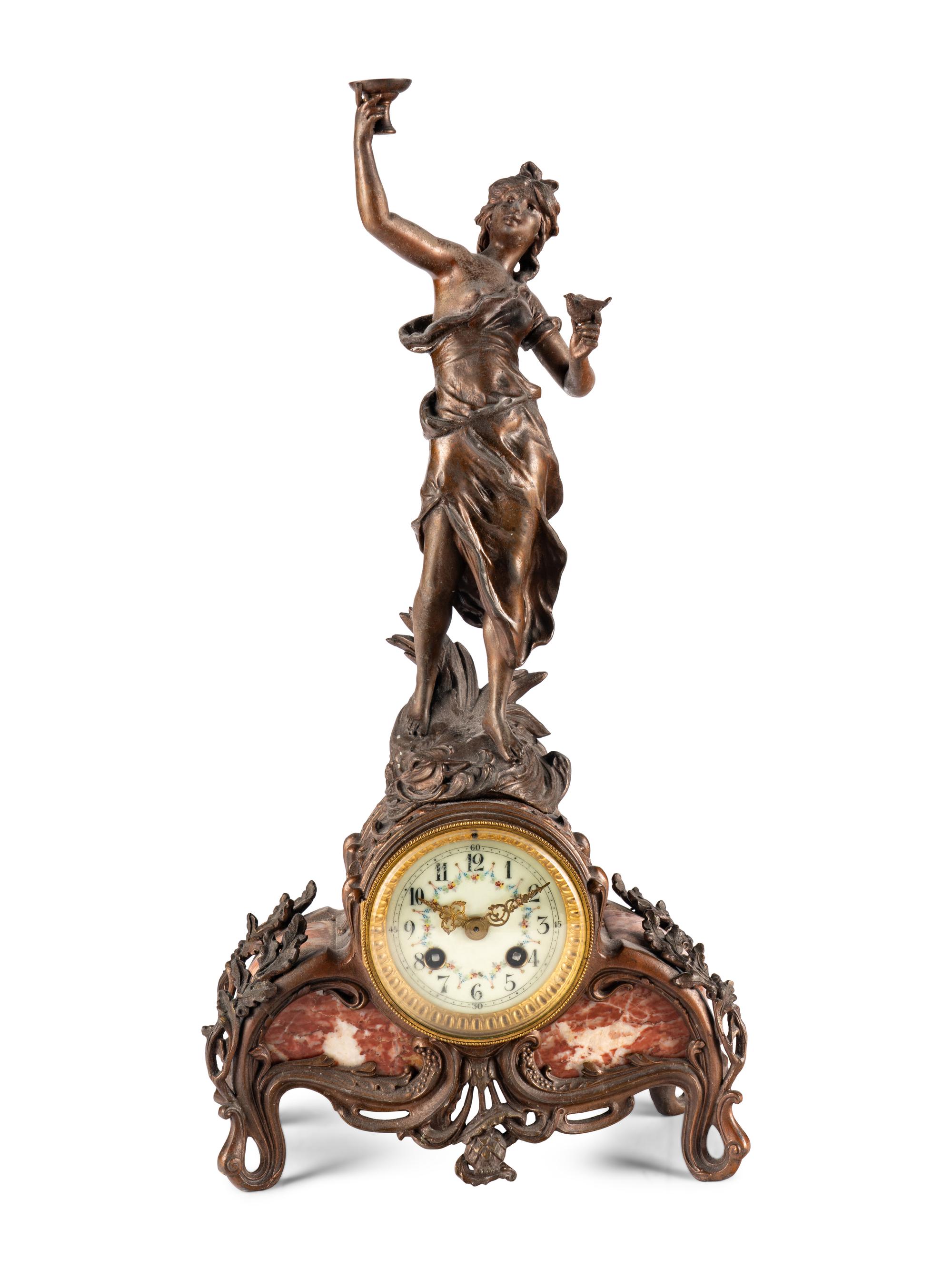A French Cast Metal and Marble Figural Clock