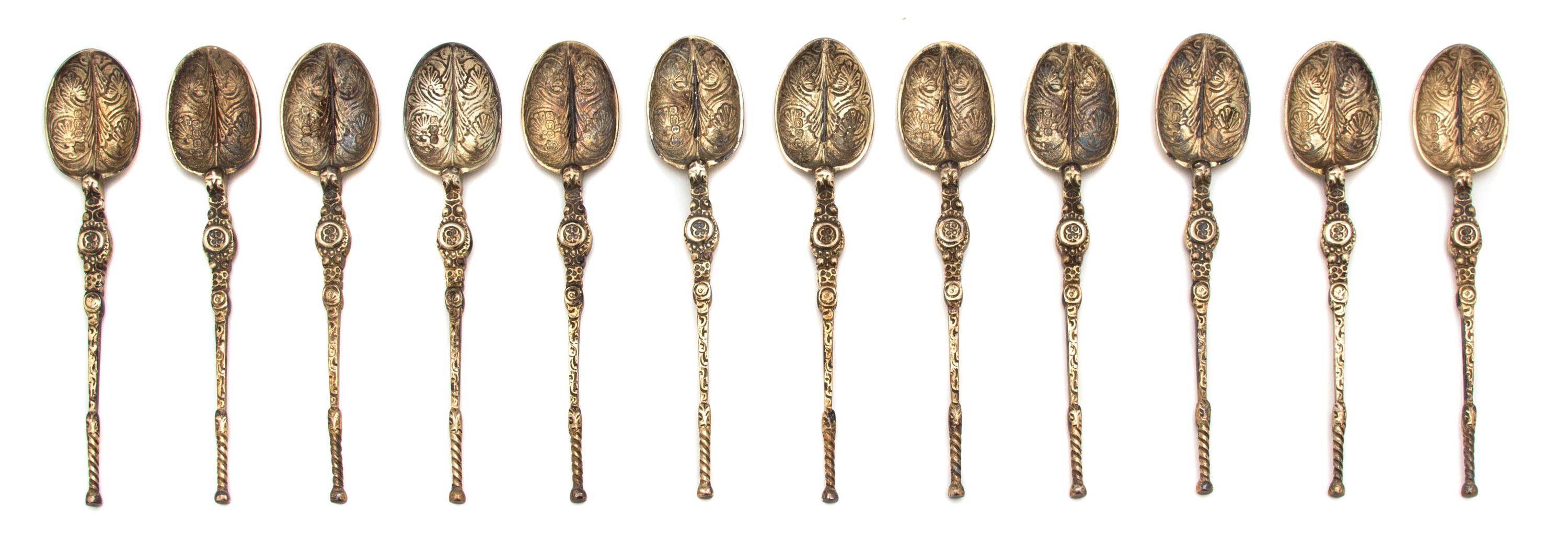 A Set of Twelve English Silver Demitasse Spoons, Thomas Bradbury & Sons, Sheffield, 1936, having turned handle and foliate-form decorat
