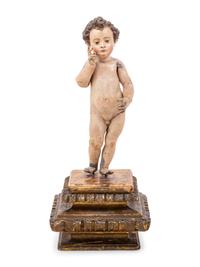 An Italian Painted Putto Figure