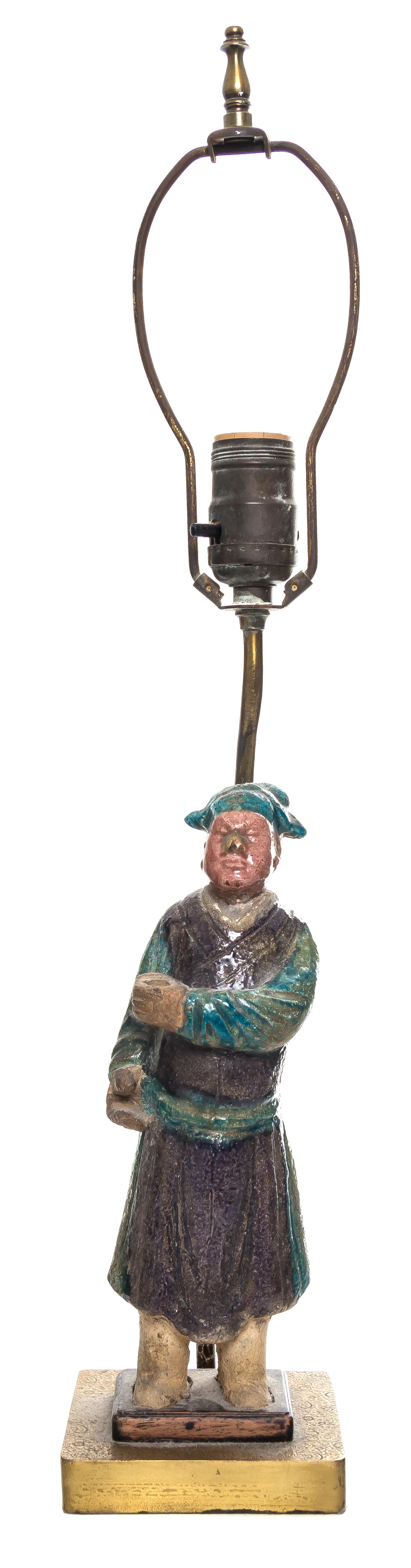 A Purple and Turquoise Glazed Pottery Figure of a Man Height of figure 10 1/2 inches.