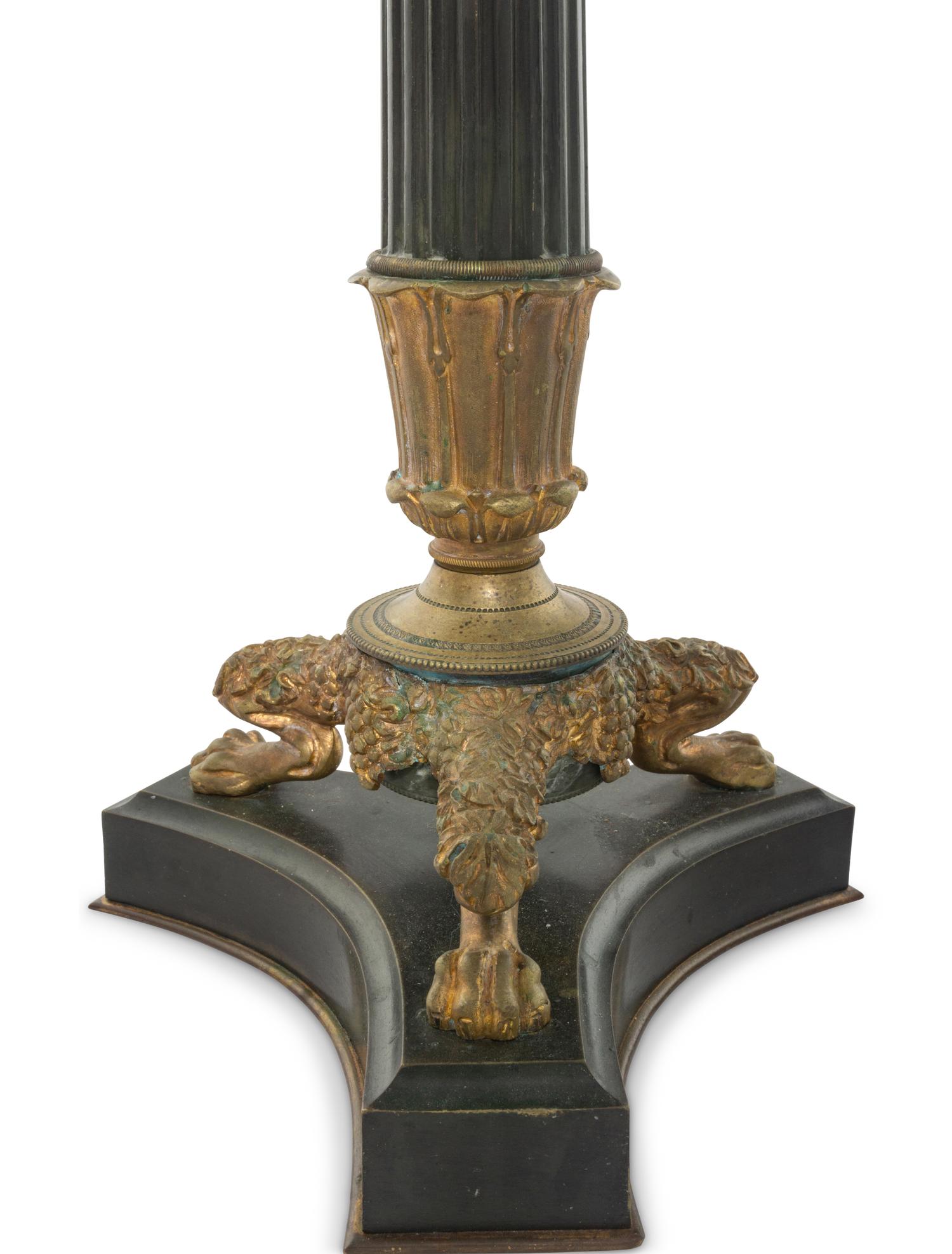 A Pair of Charles X Style Patinated and Gilt Bronze Candlesticks