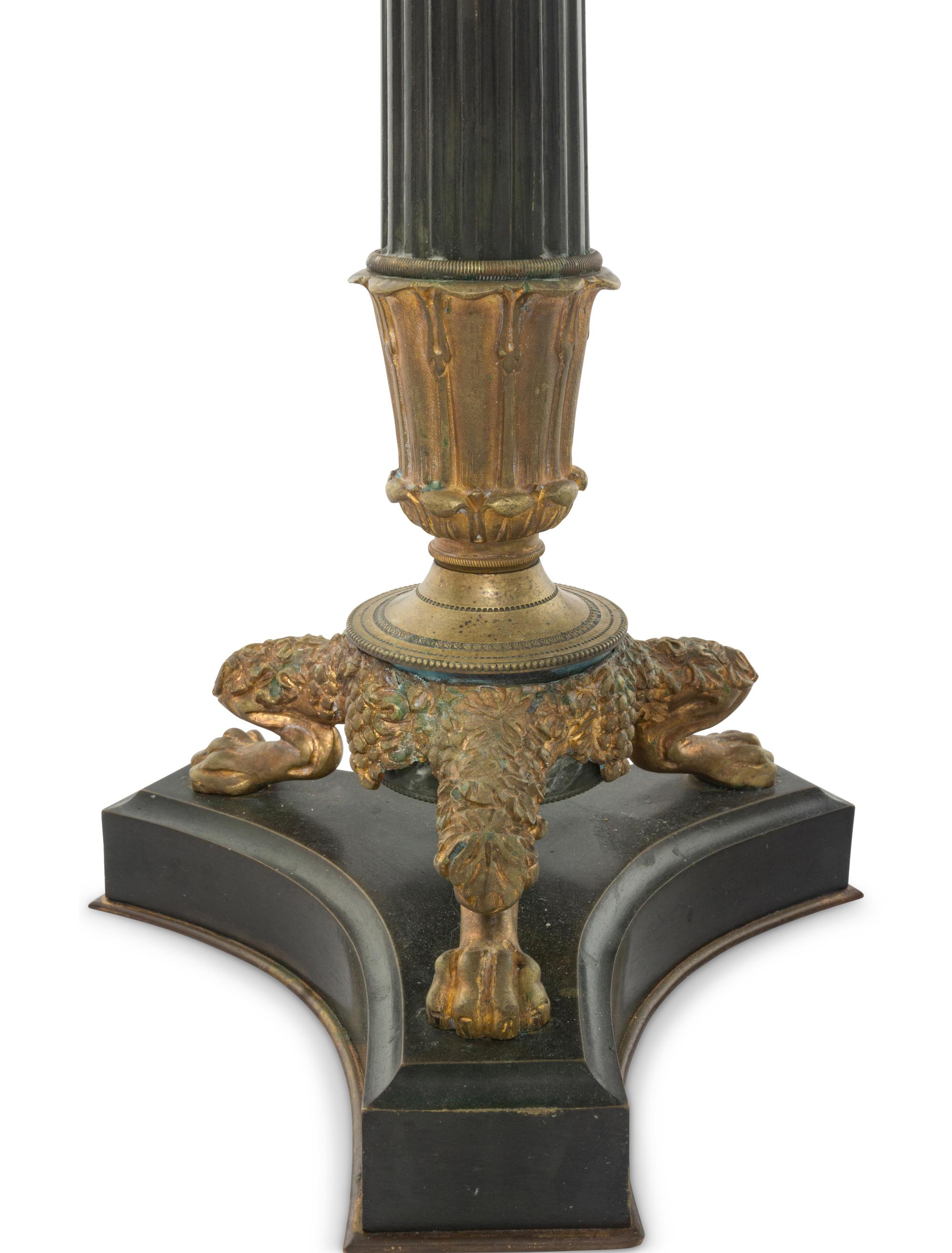 A Pair of Charles X Style Patinated and Gilt Bronze Candlesticks