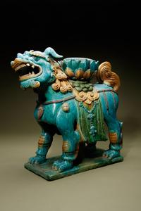 A Turquoise, Ochre and Green Glazed Tileworks 'Fu Lion' Stand