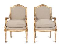 A Pair of Louis XVI Style Painted and Parcel Gilt Fauteuils — EARLY 20TH CENTURY