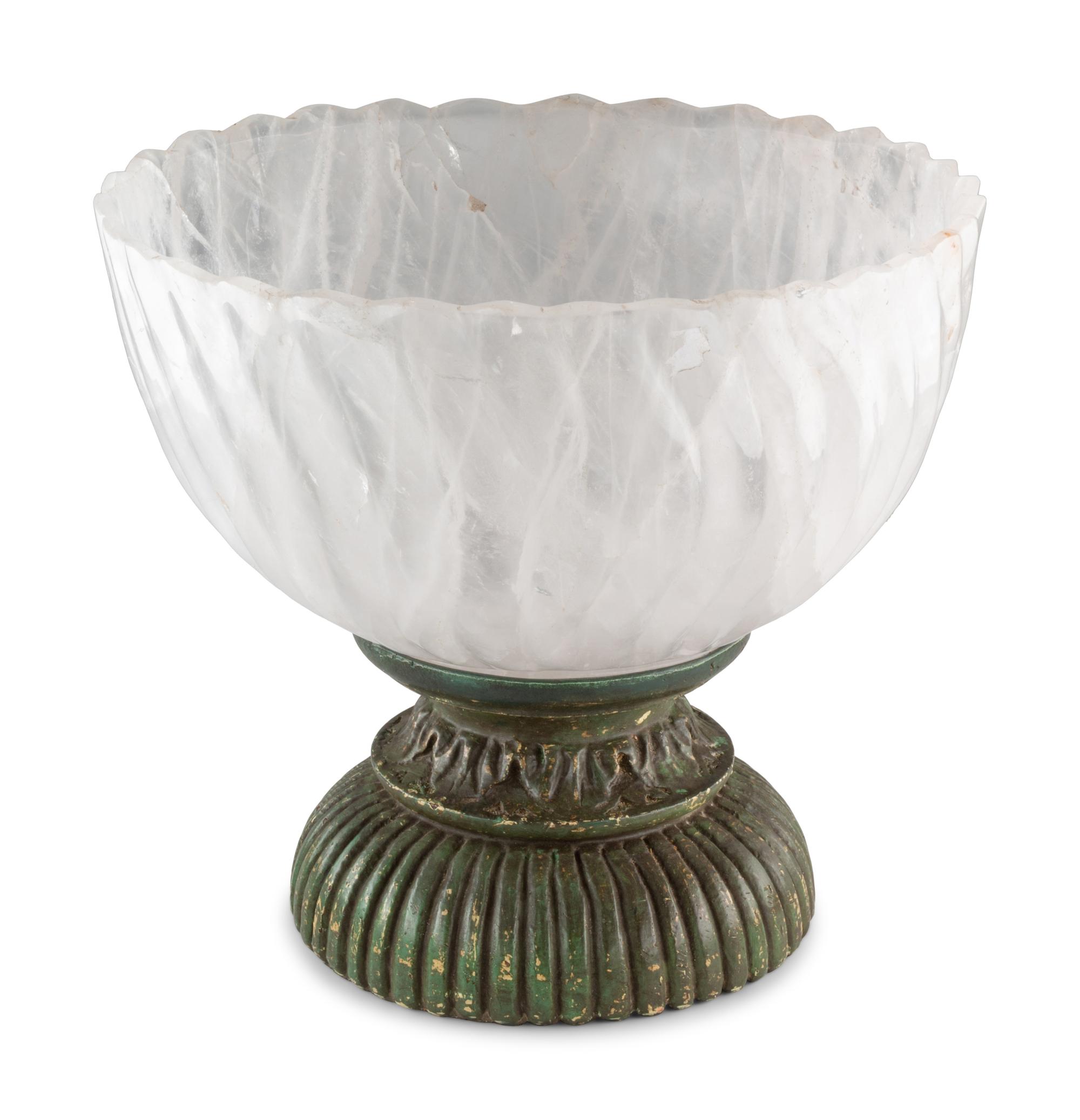 A Large Fluted Rock Crystal Bowl on a Painted Wood Stand