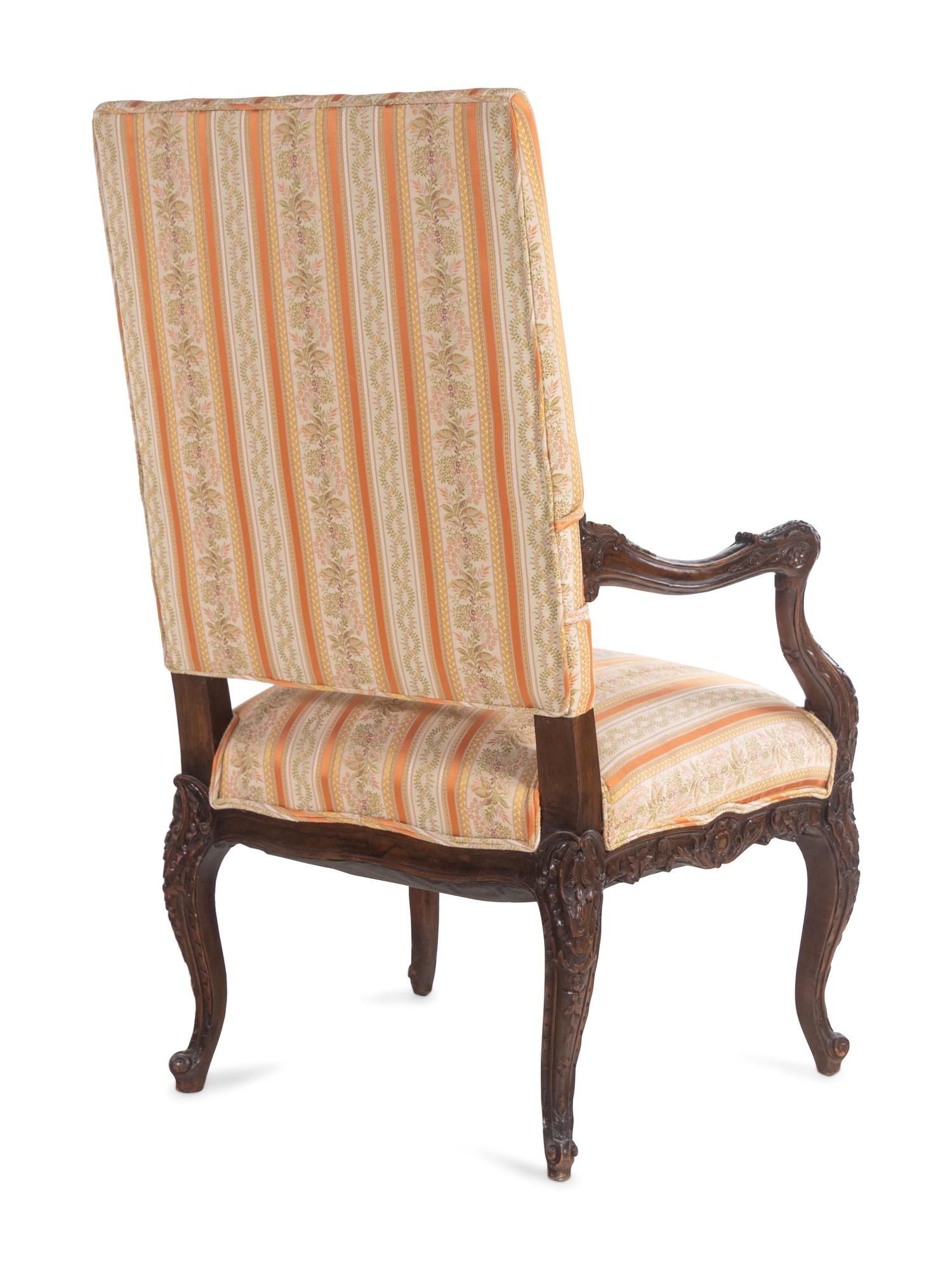 A Régence Style Carved Walnut Fauteuil