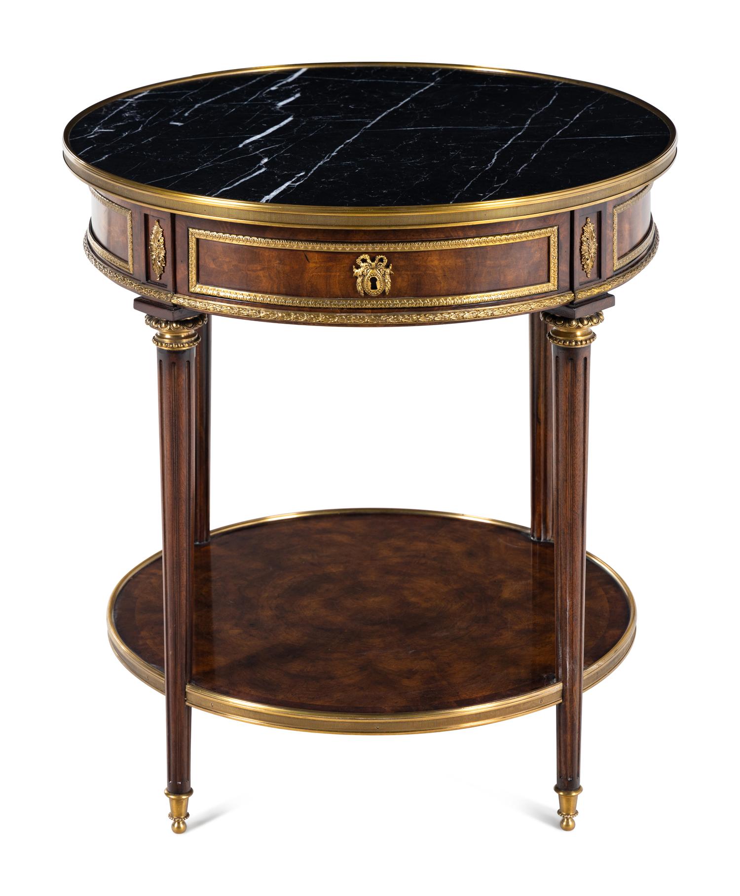 A Louis XVI Style Gilt Metal Mounted Marble-Top Mahogany Guéridon