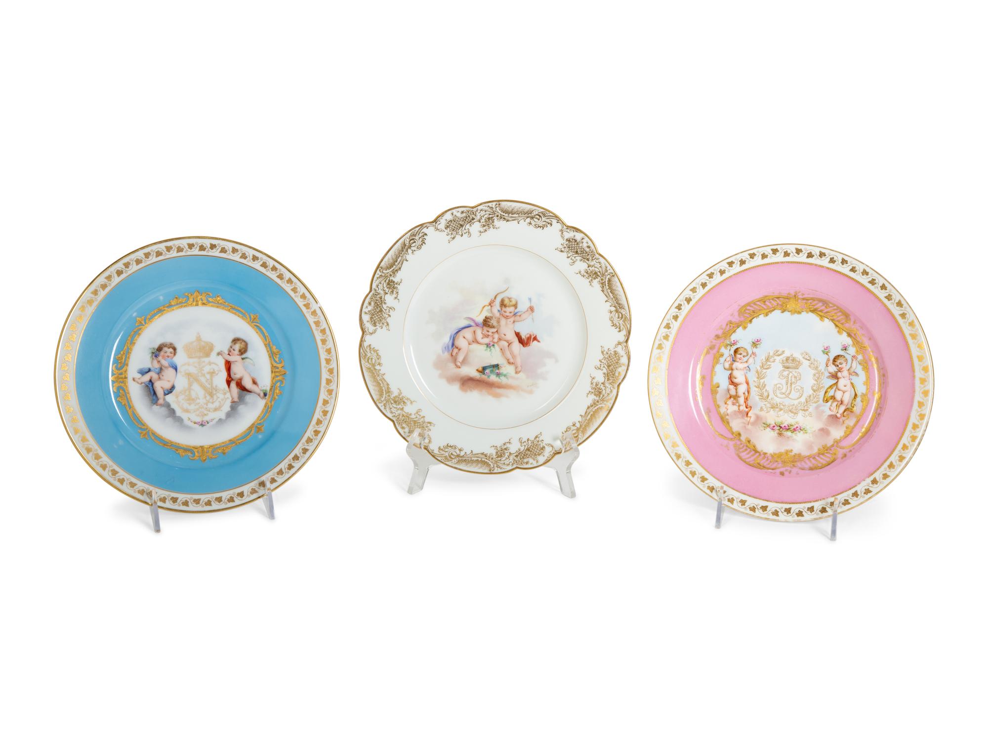 Three Sèvres Painted and Gilt Porcelain Cabinet Plates