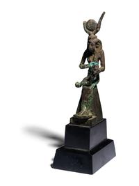 An Egyptian Bronze Isis Nursing Harpocrates