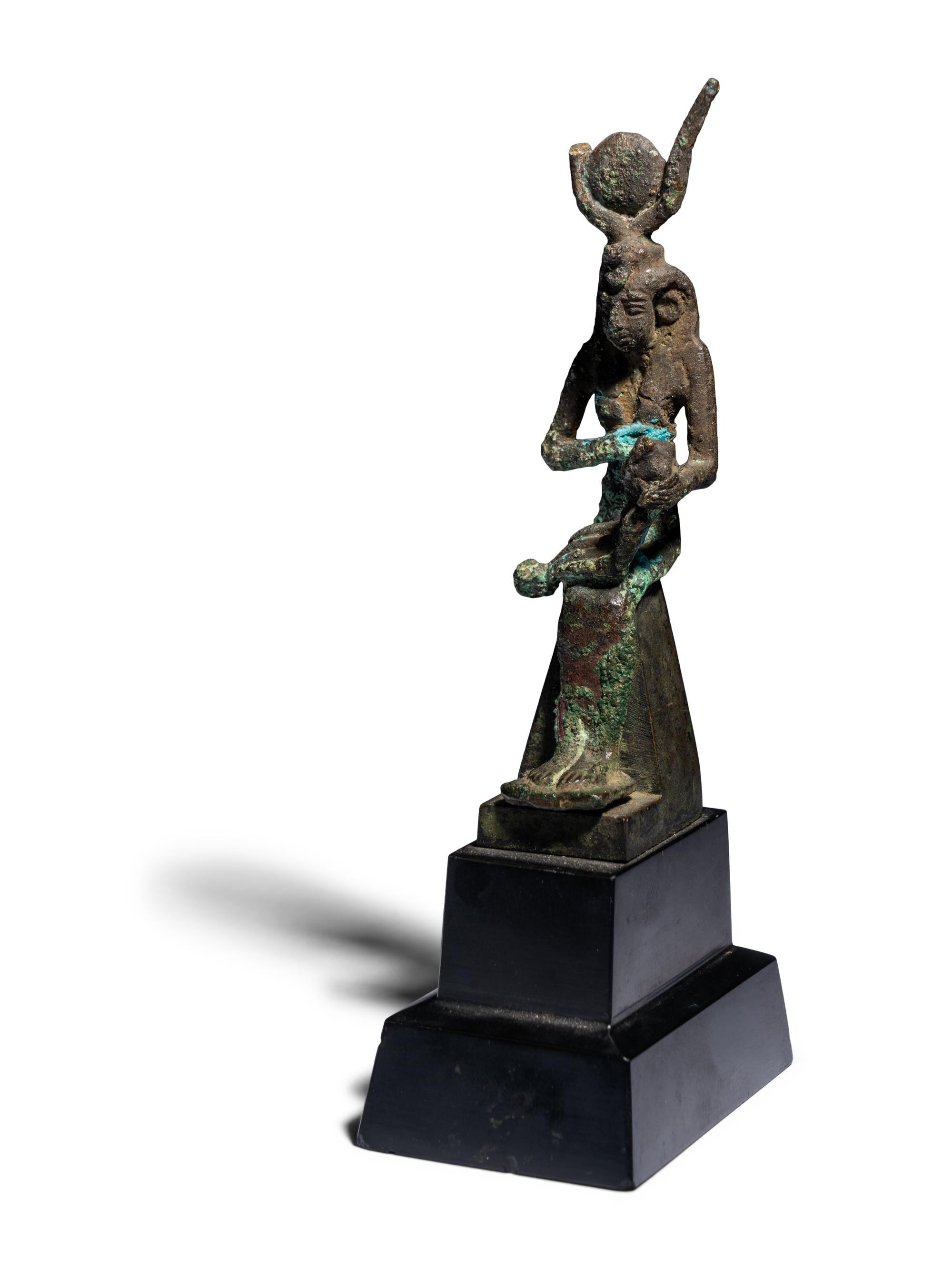 An Egyptian Bronze Isis Nursing Harpocrates