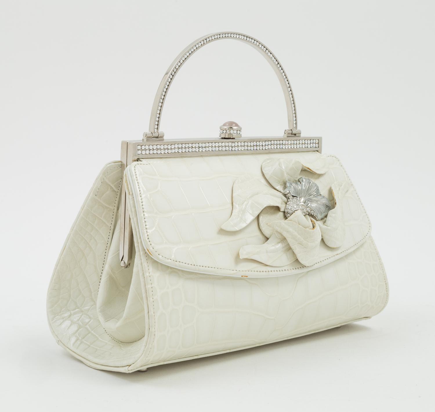 A Judith Leiber Cream Crocodile Handbag, 6.5" x 5" x 4".