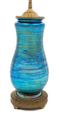 Durand, EARLY 20TH CENTURY, a glass table lamp, of baluster form with threaded decoration