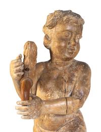 A Pair of Florentine Carved Walnut Figures of Putti on Plinths