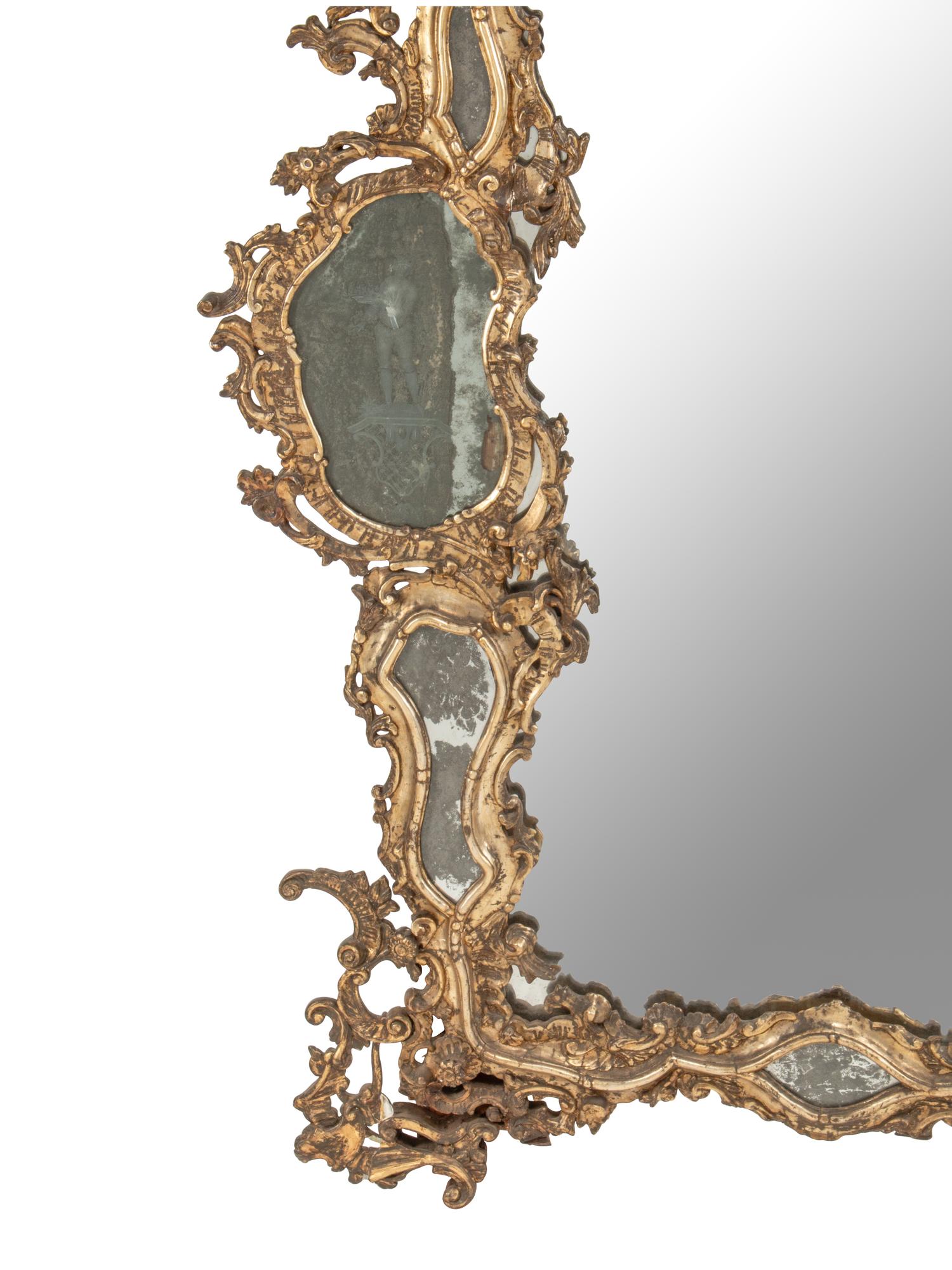 An Italian Silvered Wood and Etched Glass Mirror