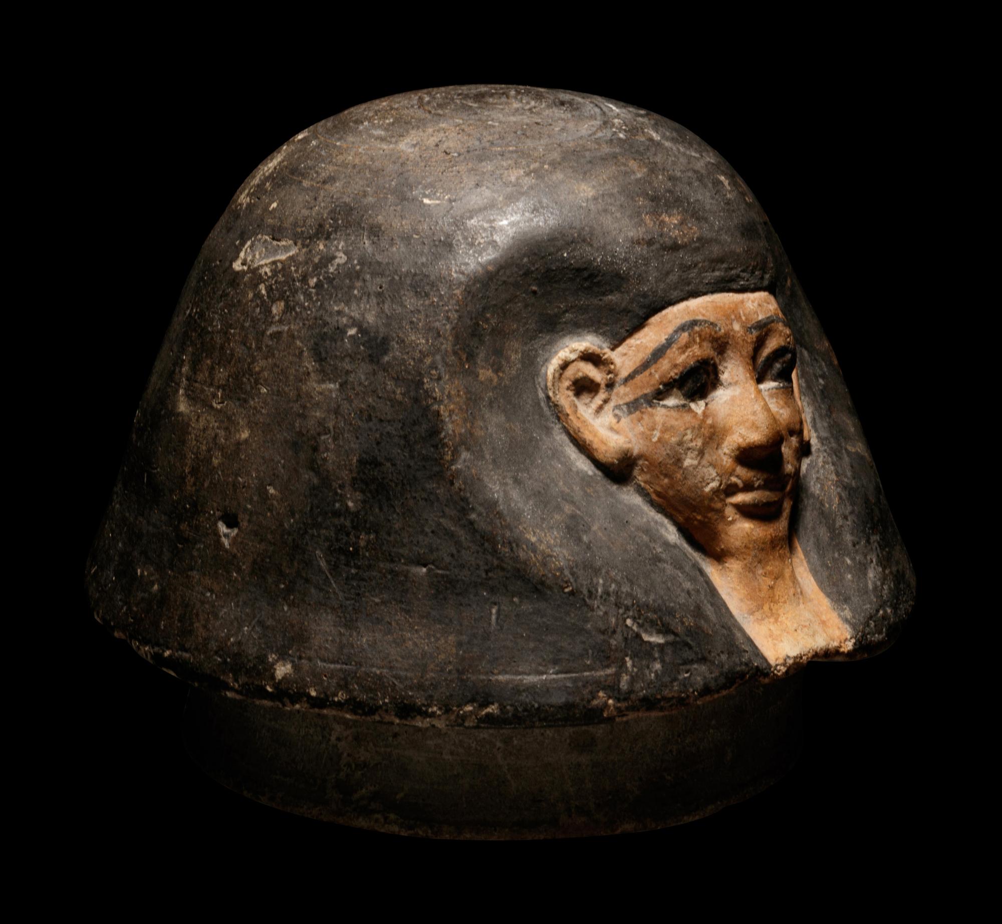 An Egyptian Canopic Jar Lid