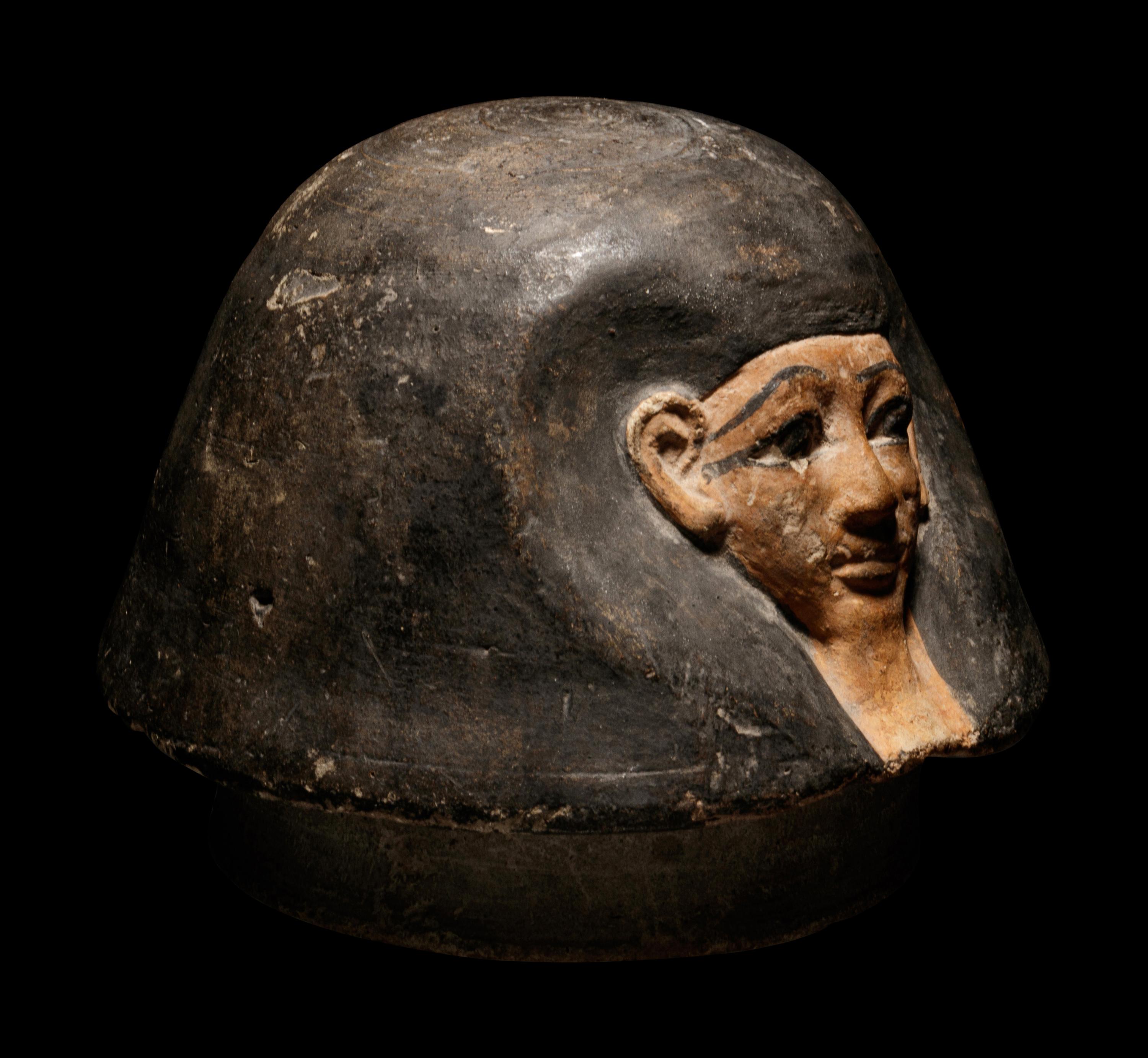 An Egyptian Canopic Jar Lid