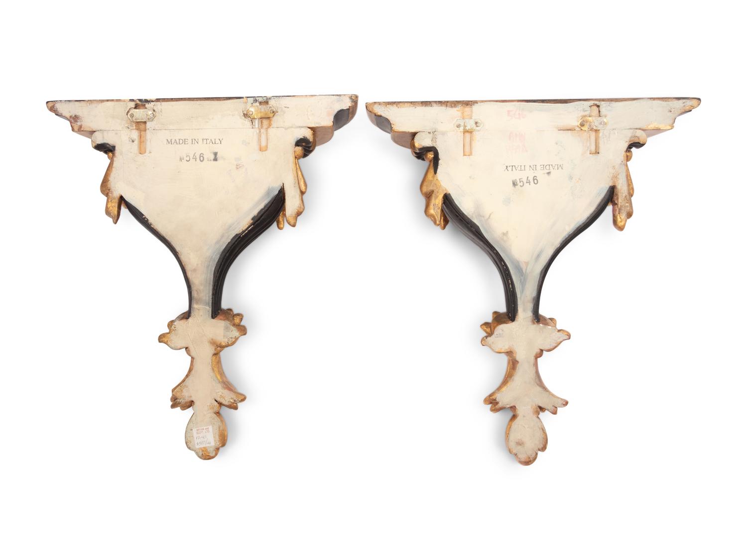 A Pair of Italian Parcel Gilt and Ebonized Wall Brackets