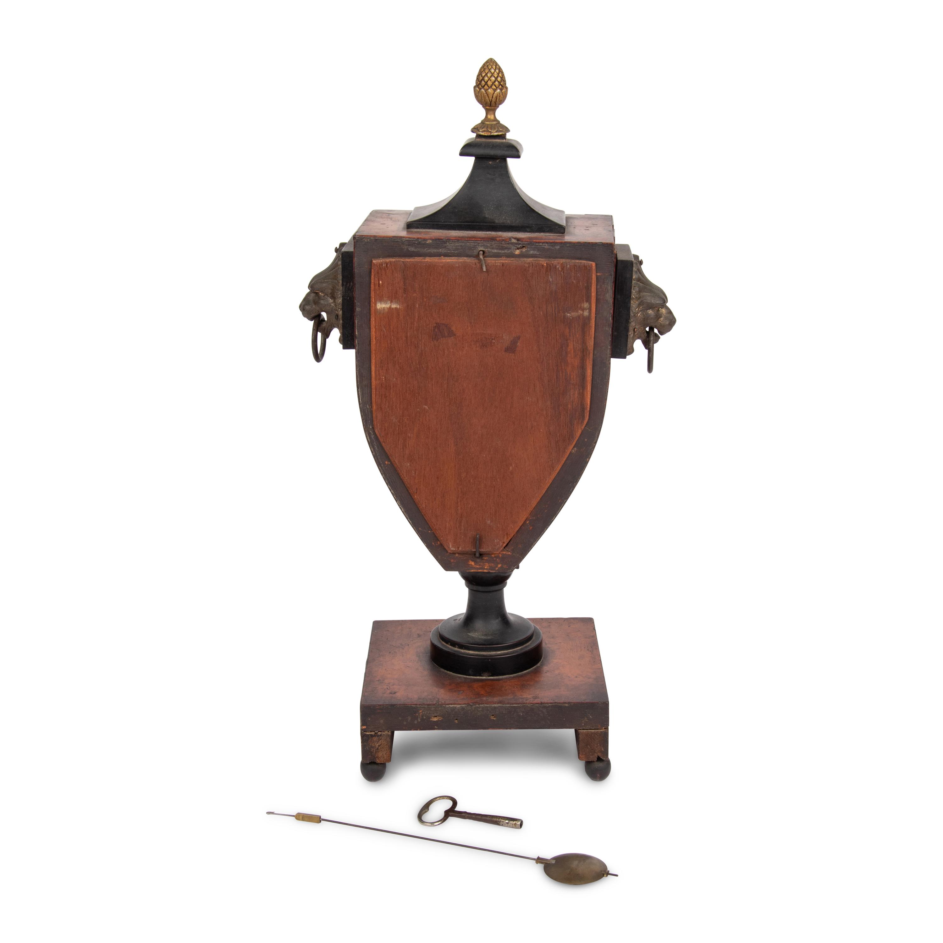 An Empire Style Burl Walnut and Part-Ebonized Mantel Clock