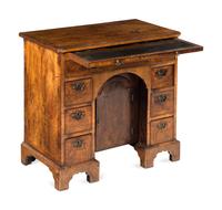 A George I Walnut Kneehole Desk
