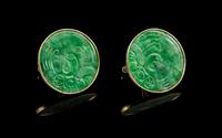 A Pair of Chinese 14 Karat Gold and Jadeite Cufflinks Diameter of jadeite 1 1/8 inches.