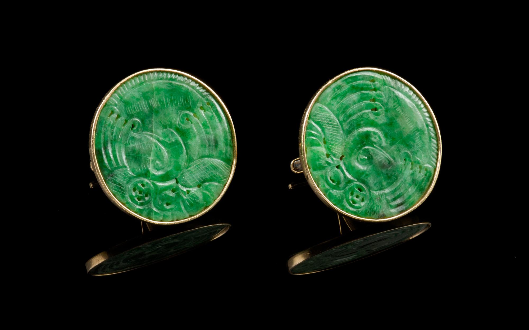 A Pair of Chinese 14 Karat Gold and Jadeite Cufflinks Diameter of jadeite 1 1/8 inches.