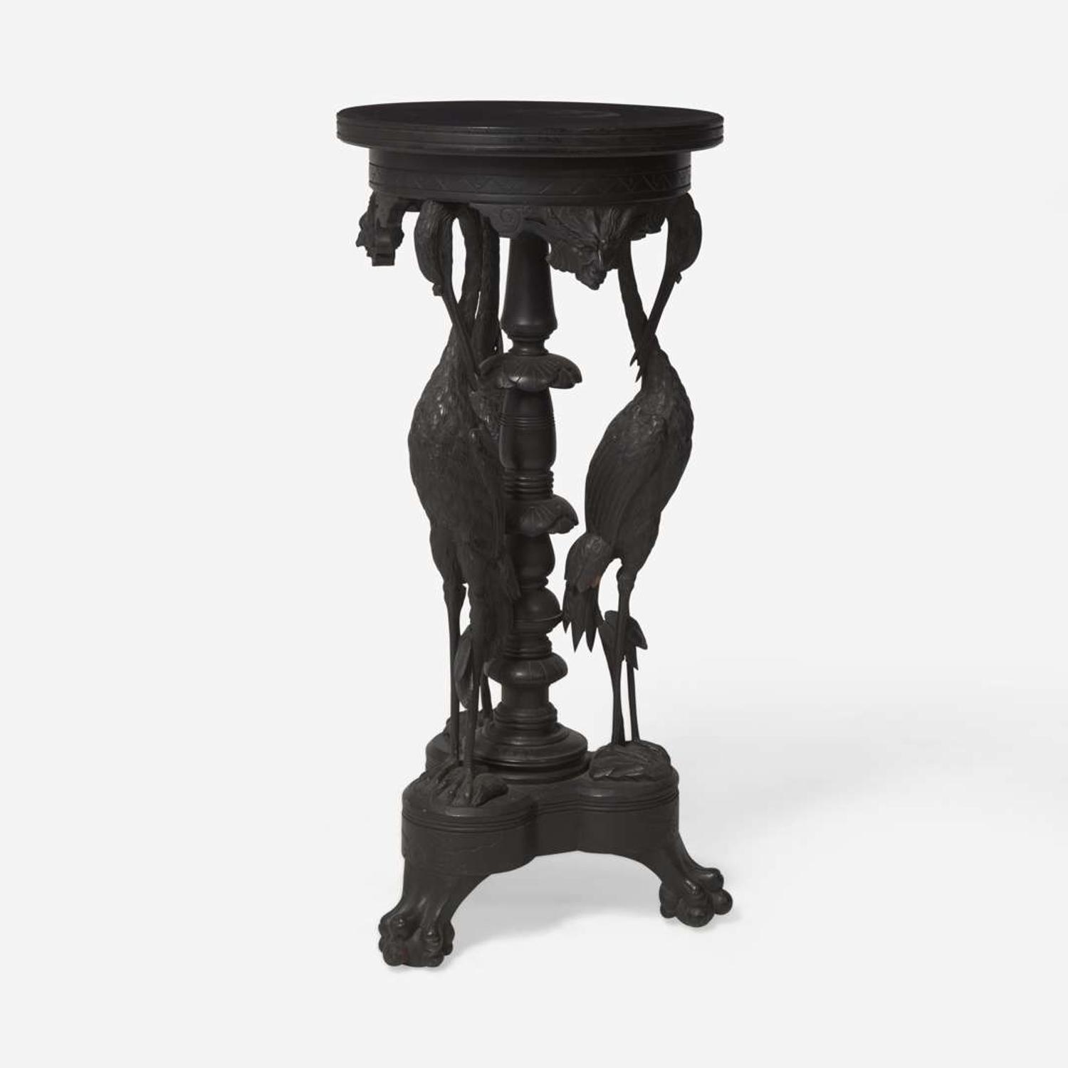 An Aesthetic Movement carved and ebonized wood pedestal with cranes late 19th century