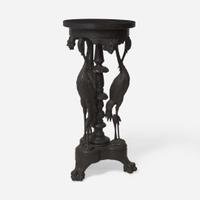 An Aesthetic Movement carved and ebonized wood pedestal with cranes late 19th century