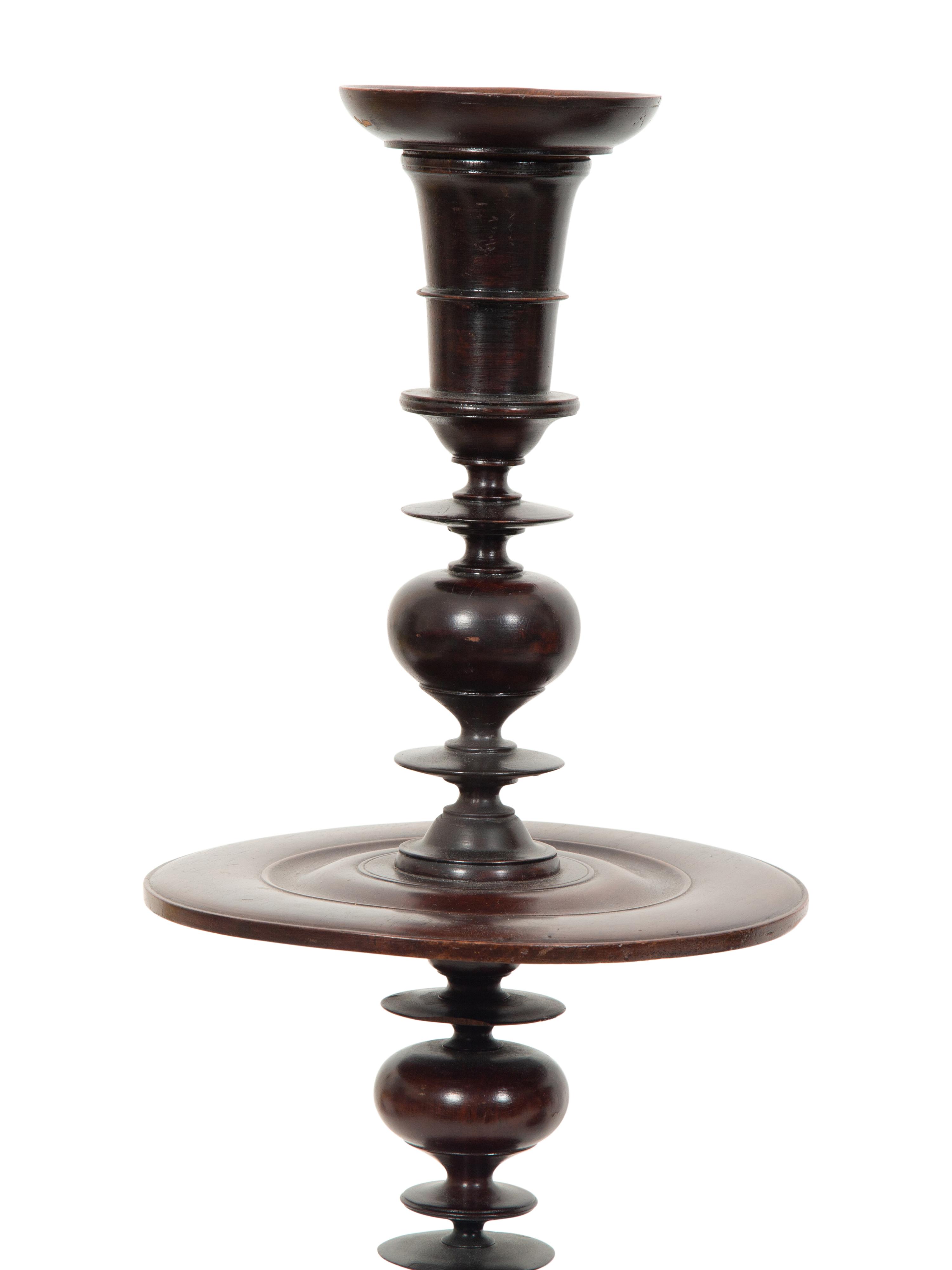 A Pair of Portuguese Colonial Jacaranda Candlesticks