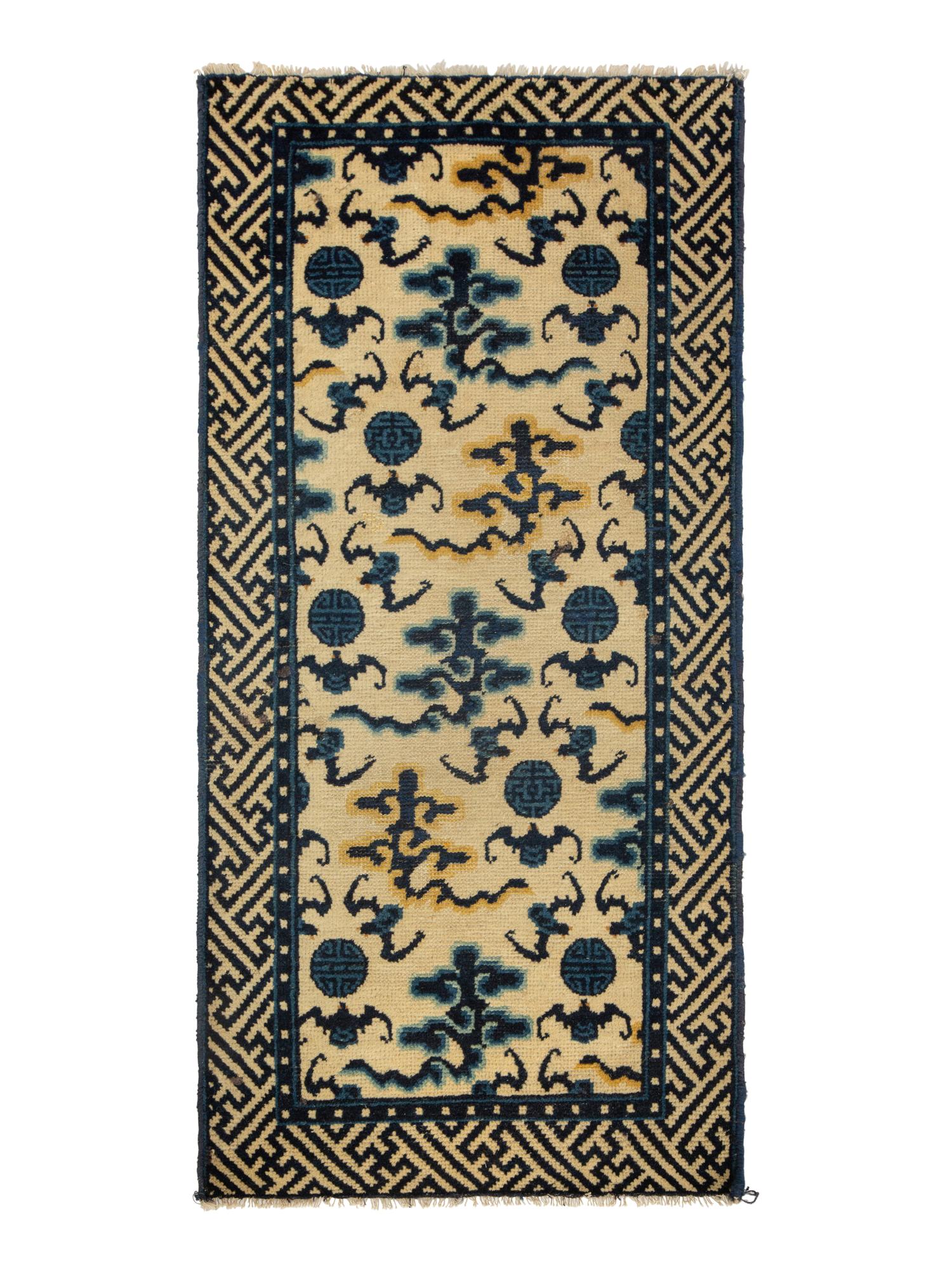 A Group of Four Chinese Rugs